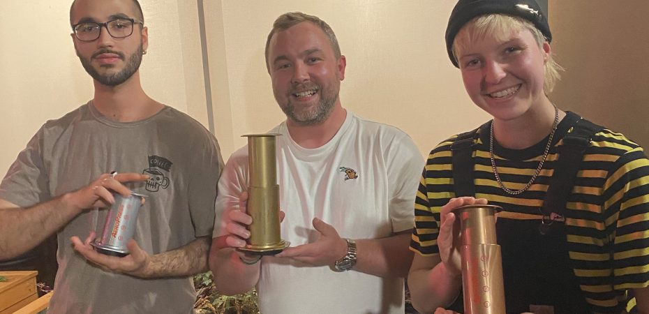 Irish Aeropress Championship winners holding aeropress trophy