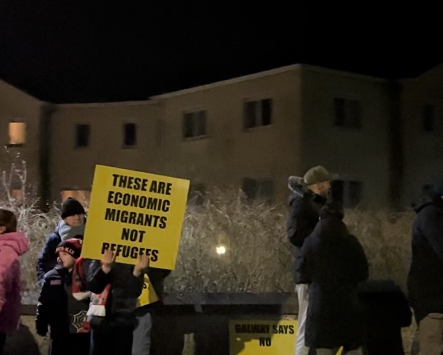 Residents protest in Ballybane with sign that reads "These are economic migrants not refugees"
